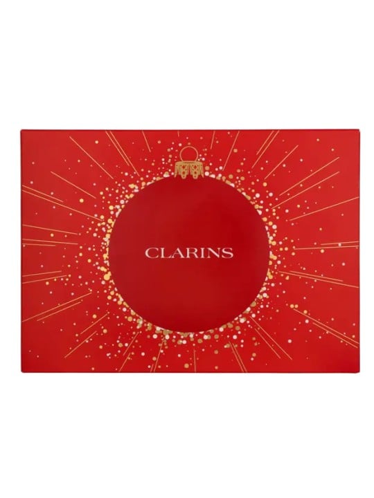Clarins Aroma Set Tonic Treatment Oil 100 ml   Exfoliating Body Scrub 30 ml   Tonic Hydrating Oil-Balm 30 ml    Large Pouch 15m